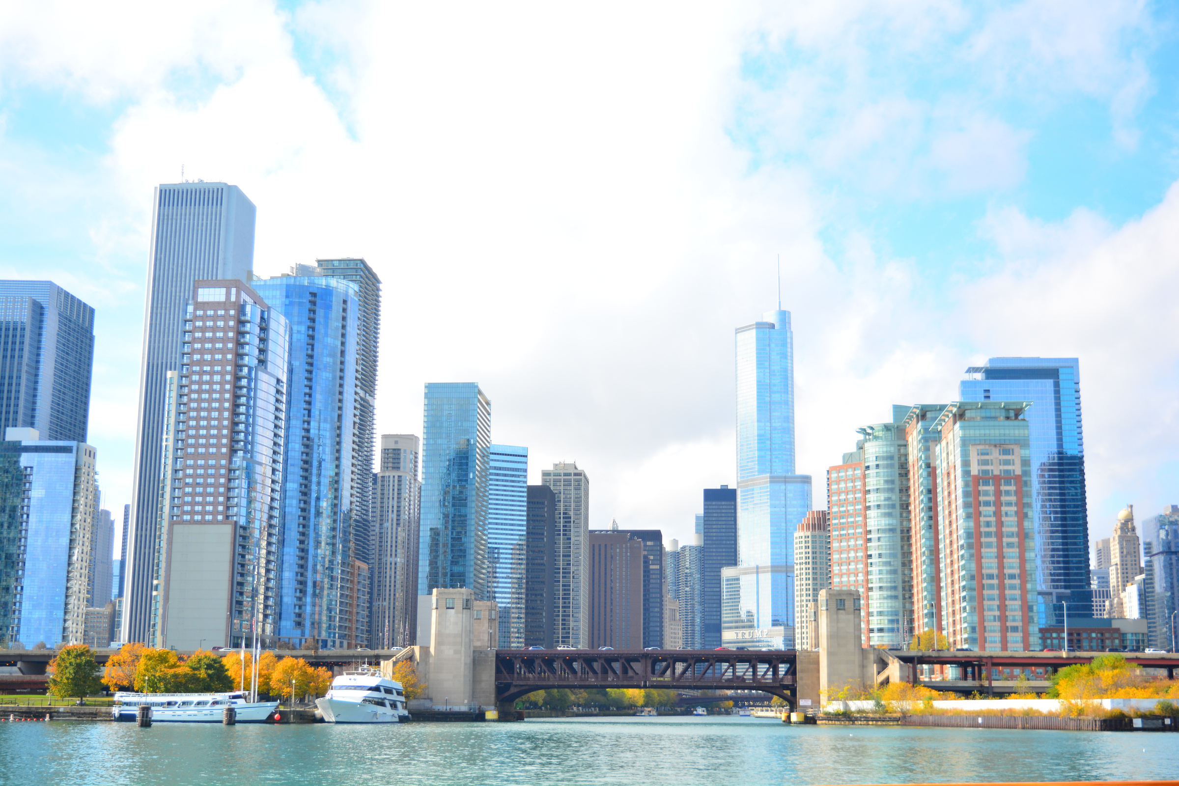 City at Waterfront Against Cloudy Sky